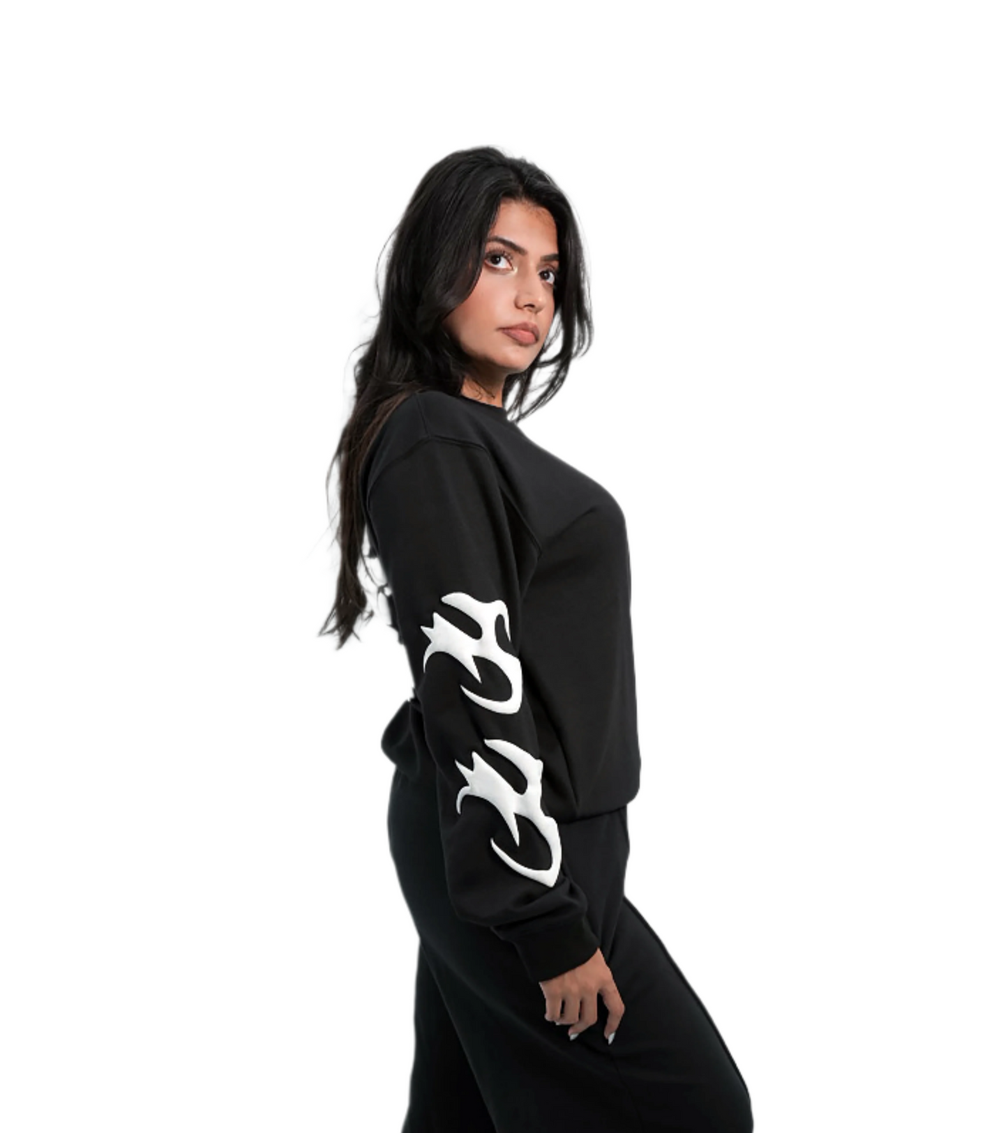 Person wearing a black outfit with white designs on a white background