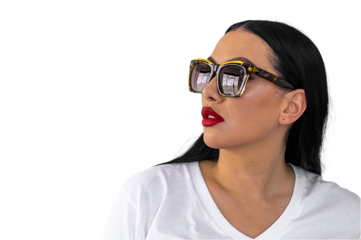 Woman wearing sunglasses and a white shirt against a light gray background