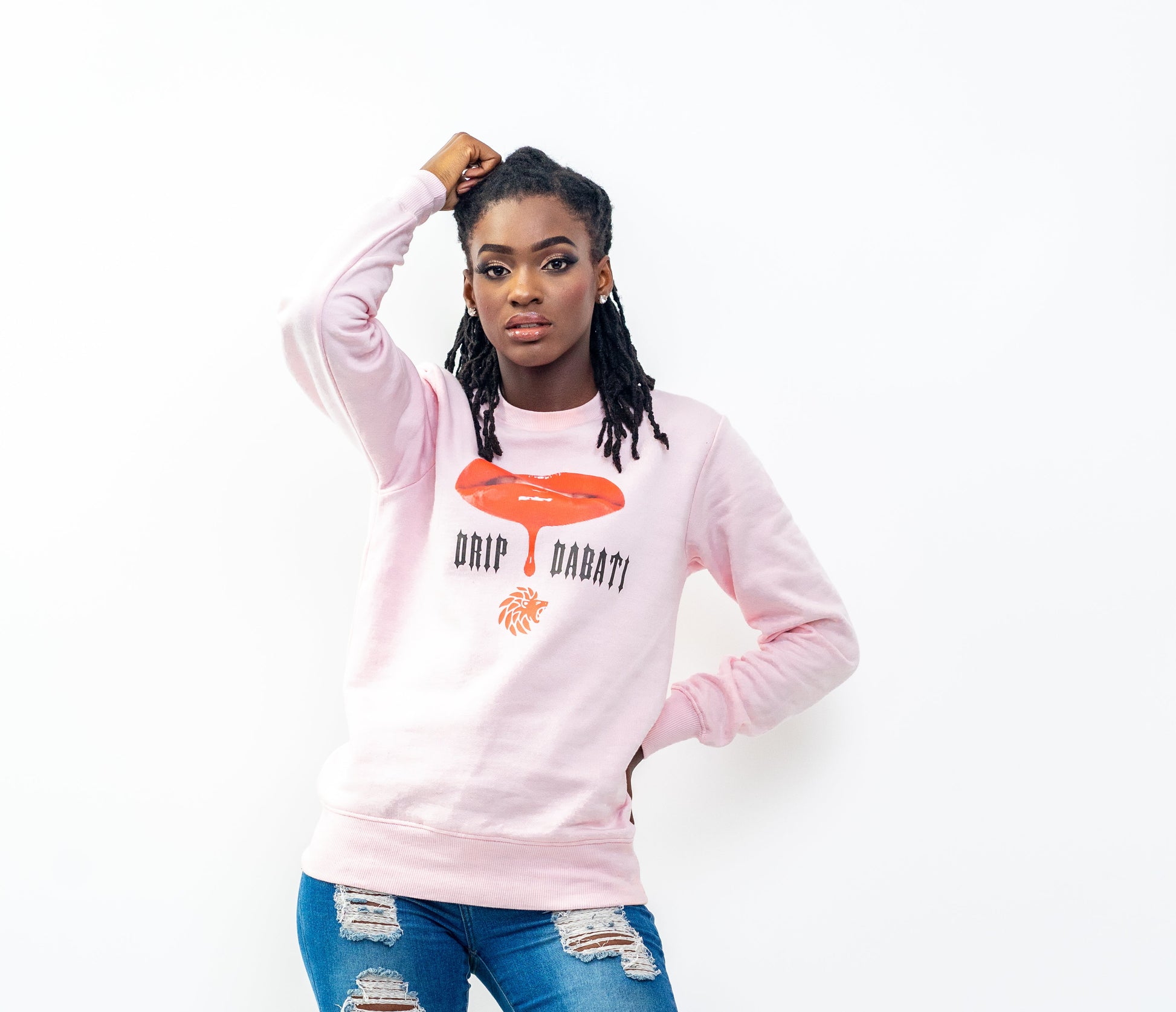Person wearing a pink sweatshirt with text and graphics on a white background