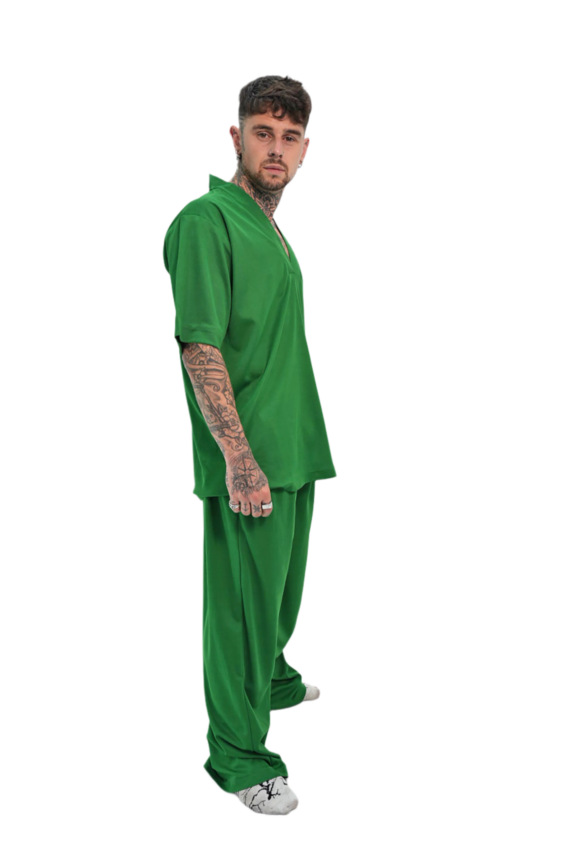Man wearing a green outfit on a white background