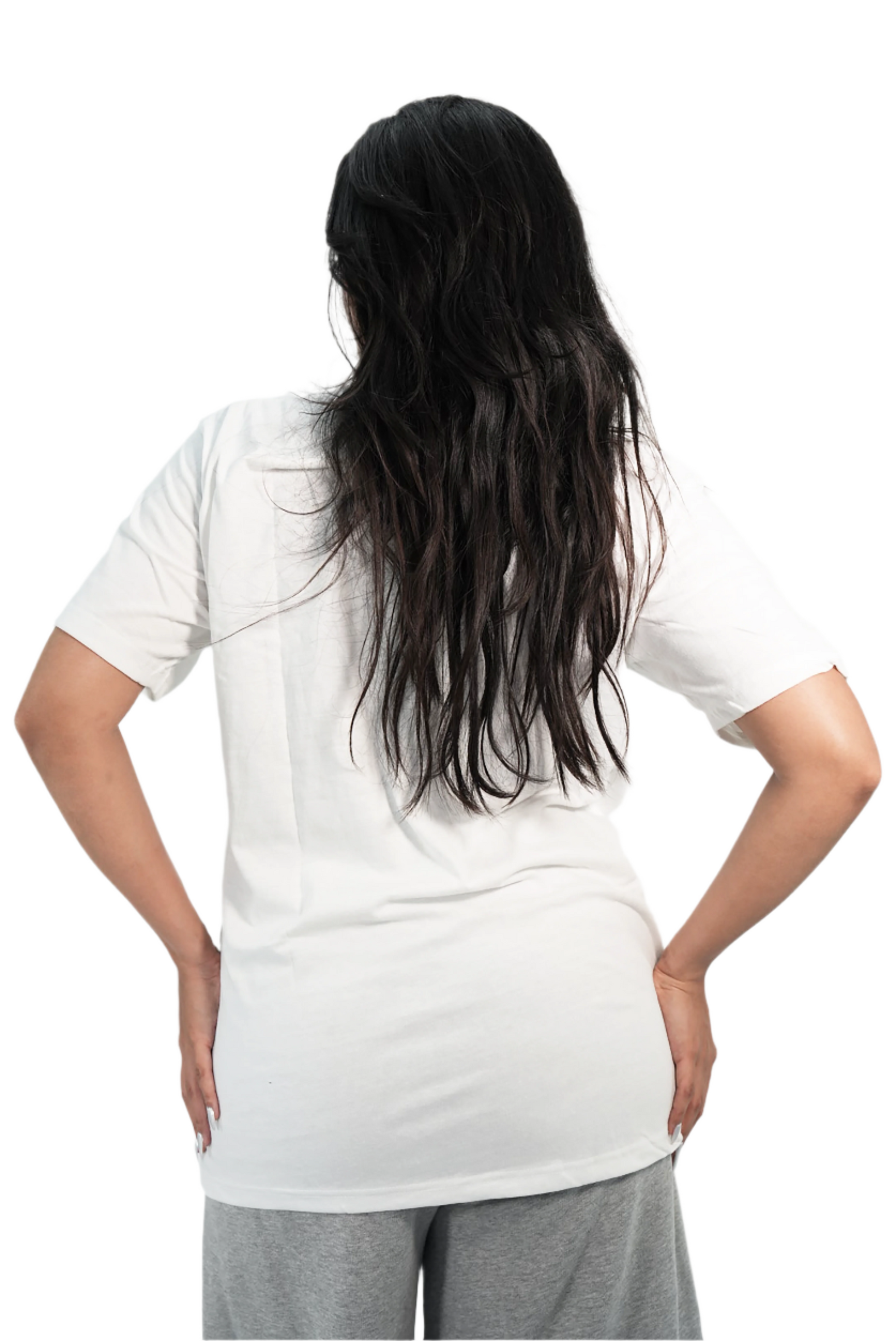 Person wearing a white t-shirt and gray pants against a plain background