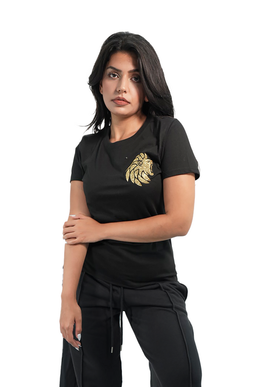 Woman wearing a black outfit with a gold emblem on a white background