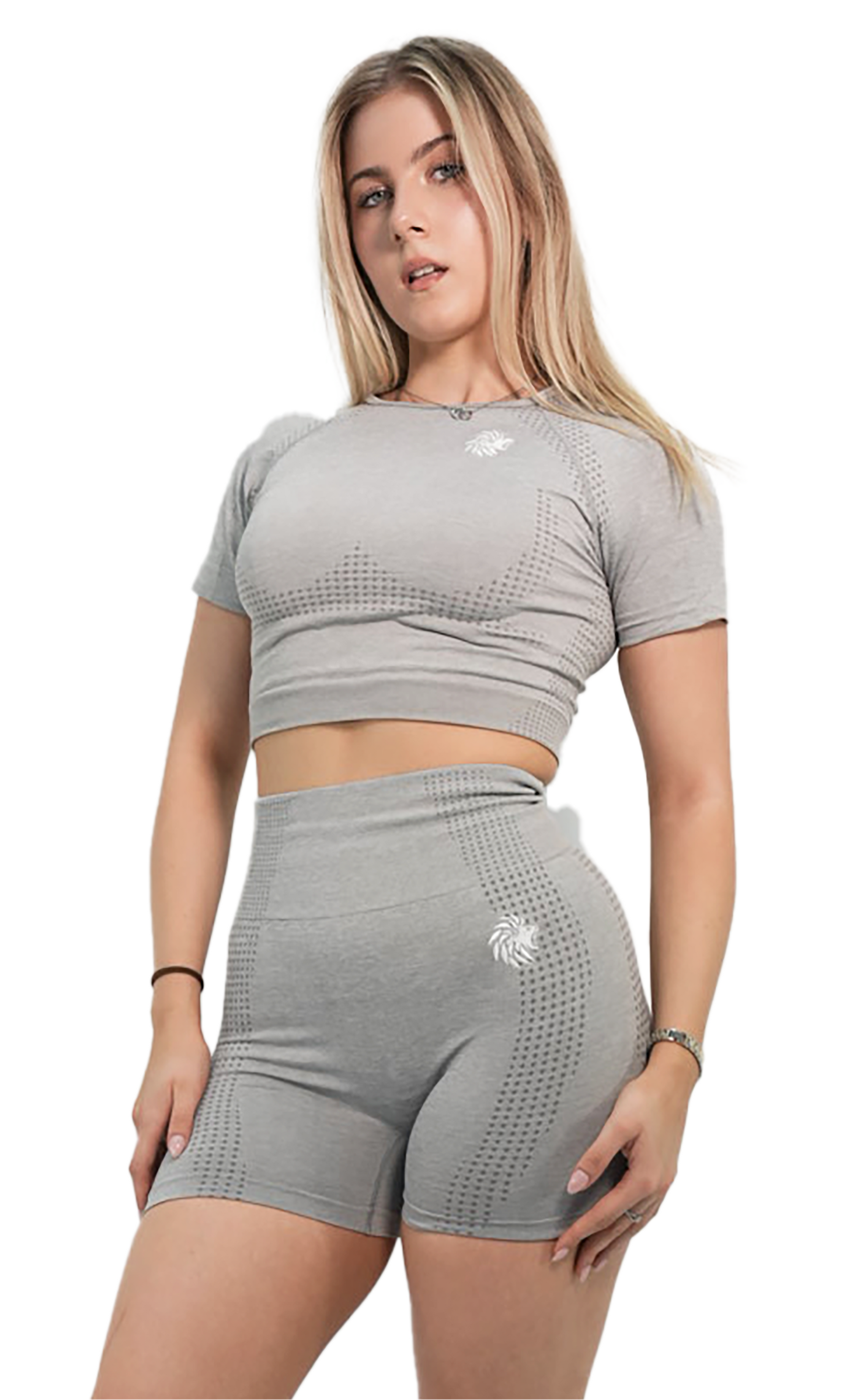 Woman wearing a gray athletic outfit on a white background