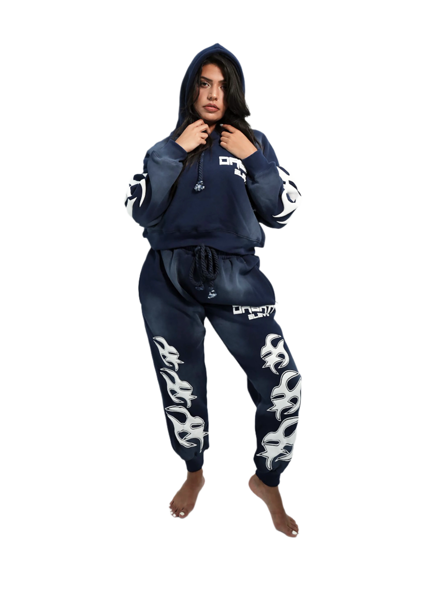 Person wearing a navy blue tracksuit with white designs on a white background