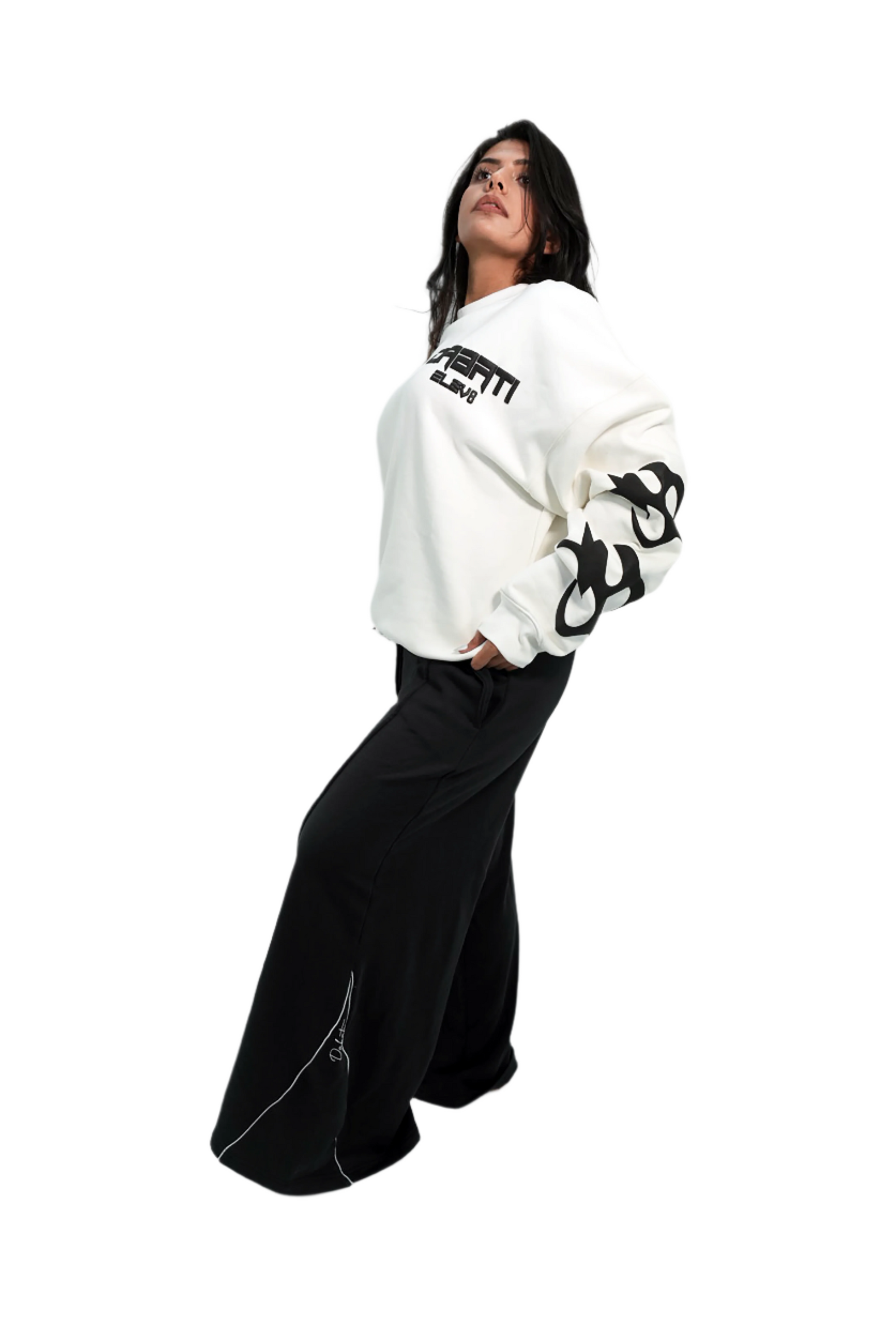 Person wearing a white sweatshirt with black text and graphics on a plain background