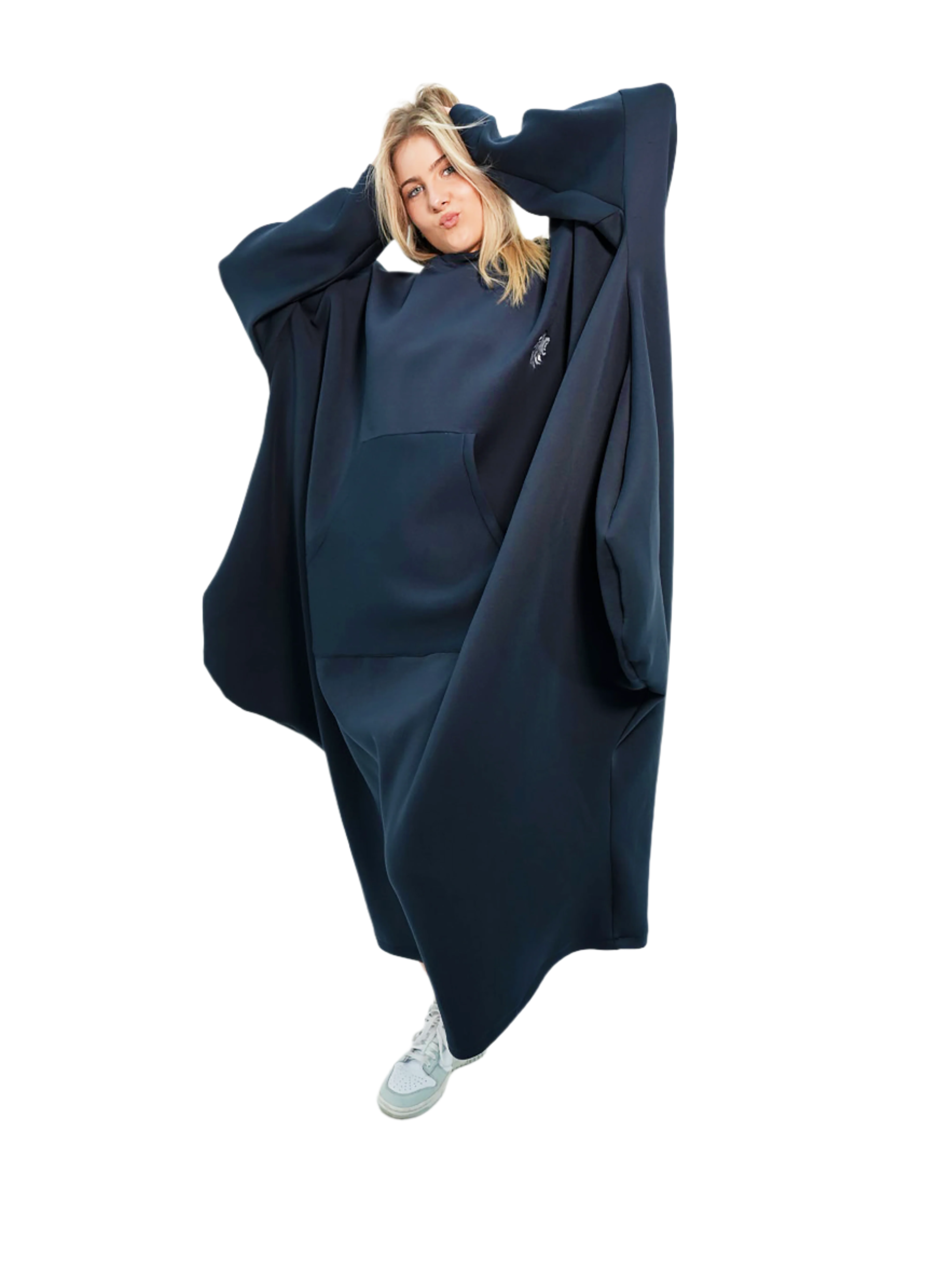 Person wearing a large navy blue hoodie on a white background