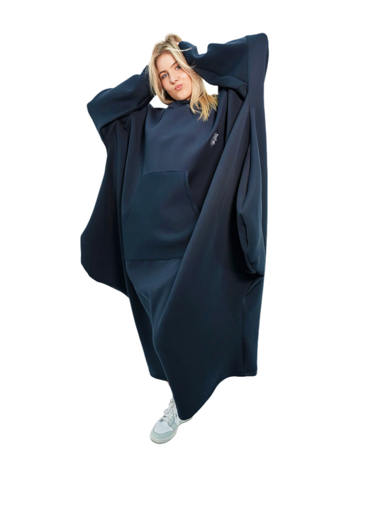Person wearing a large navy blue hoodie on a white background