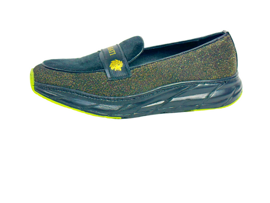 Navy slip-on shoe with green sole on a white background